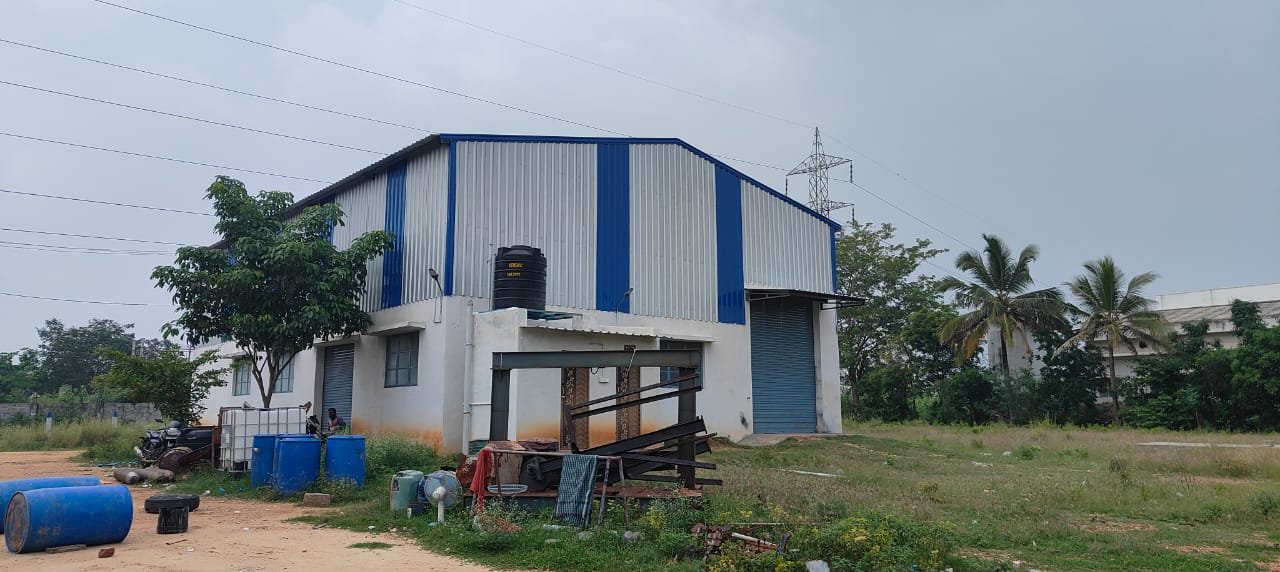 Industrial building with large shutter loading door for factory use Coimbatore